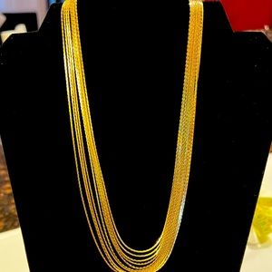 A 10 strand gold necklace
